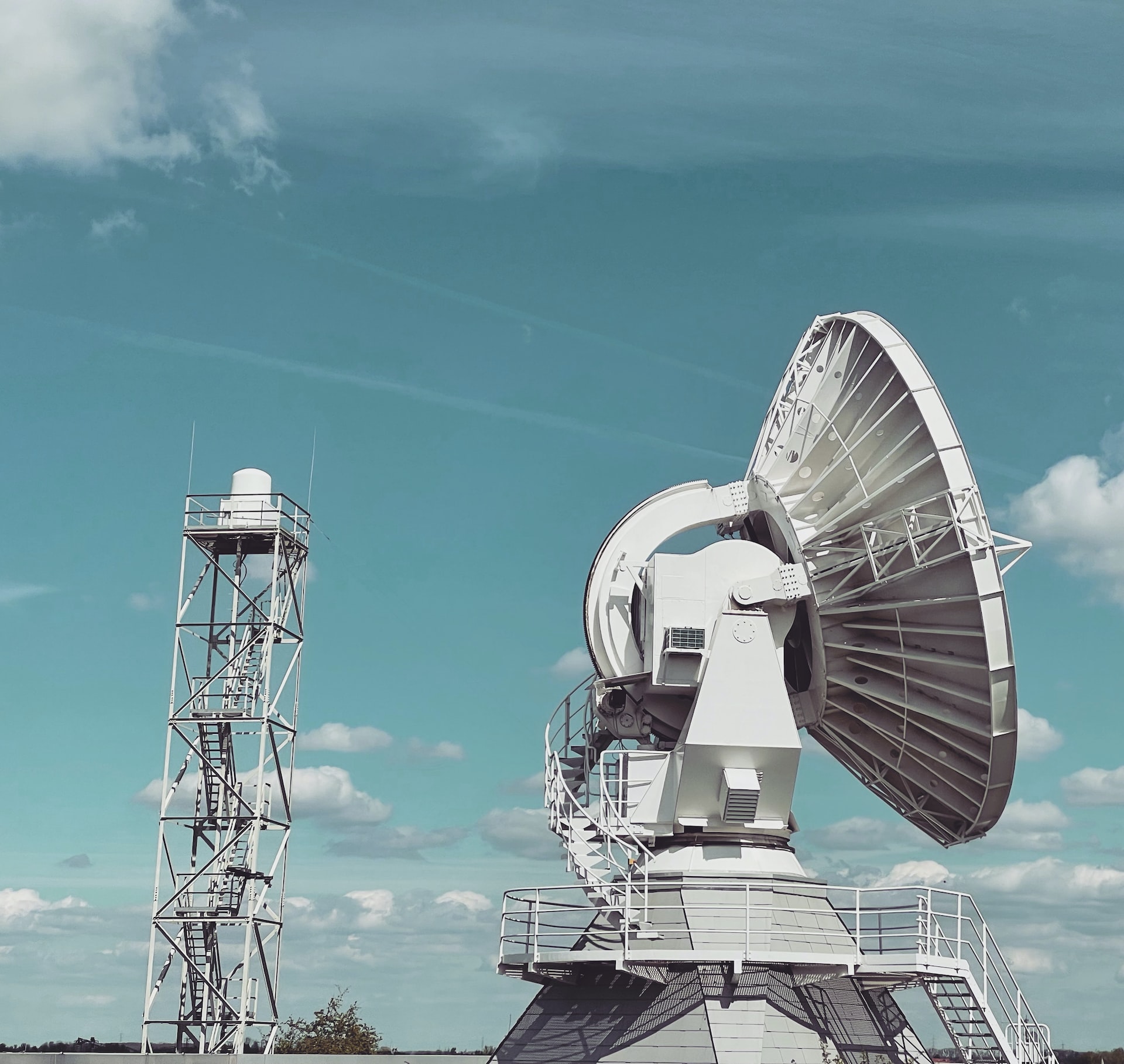 a large satellite dish sitting on top of a field